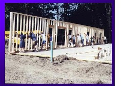 Maranatha Volunteers raise the first wall.